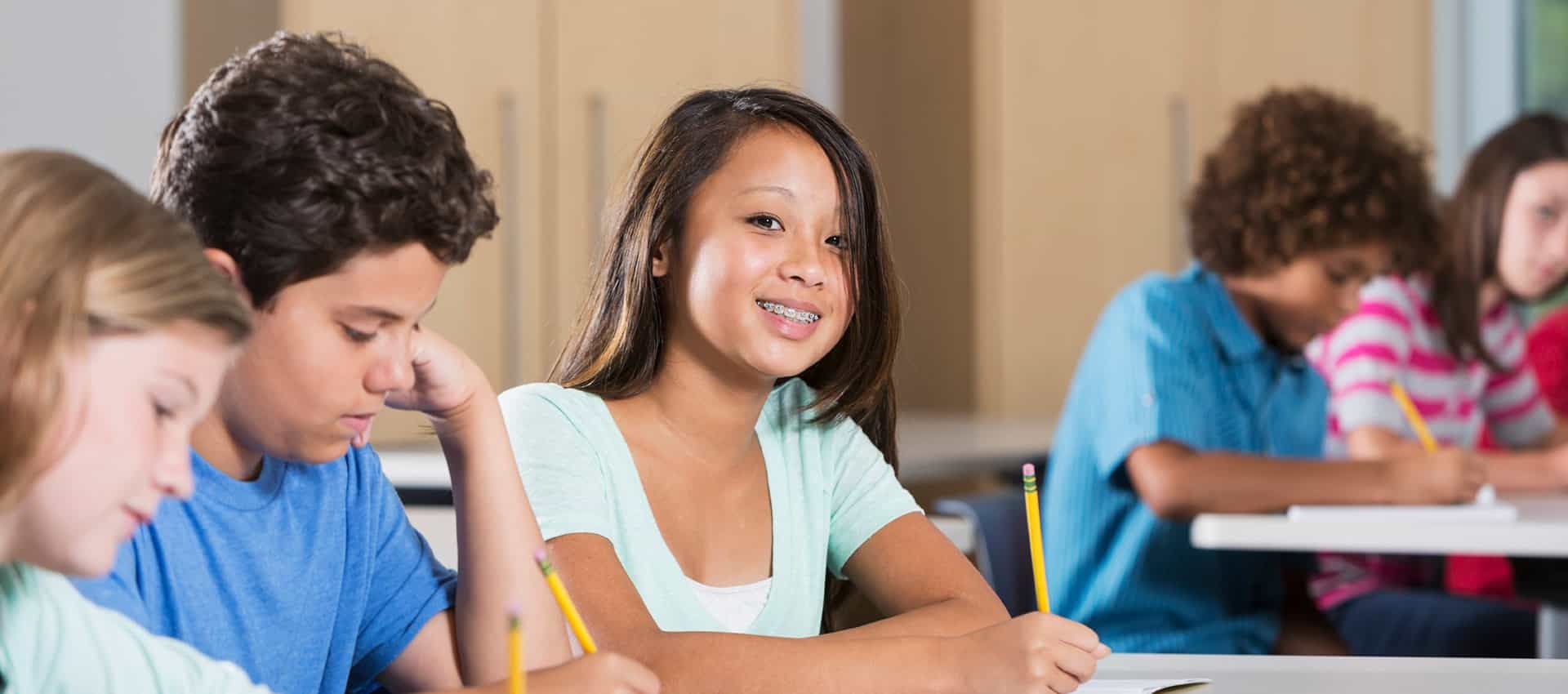 Girl in class smiling